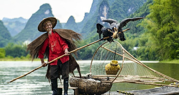 Cormorant fisherman photography scene on the Li River in Guilin